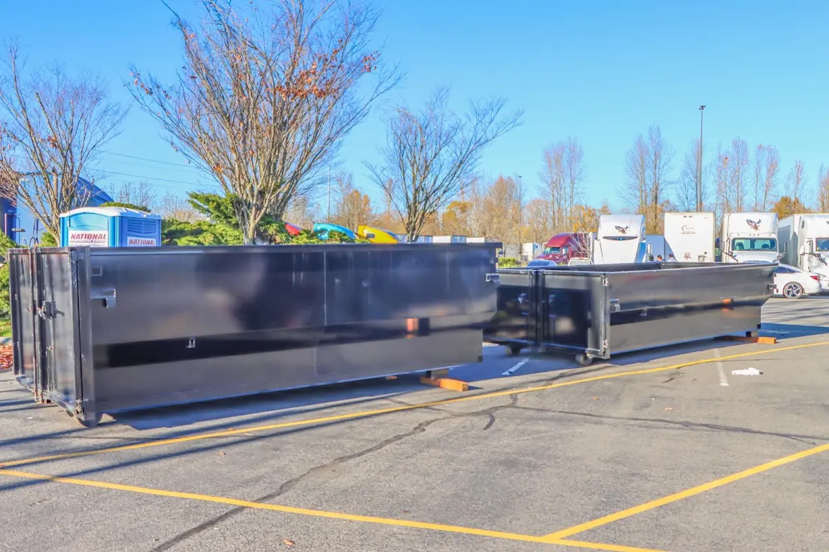 Professional dumpster rental service with roll-off container on residential driveway in Mountain Park